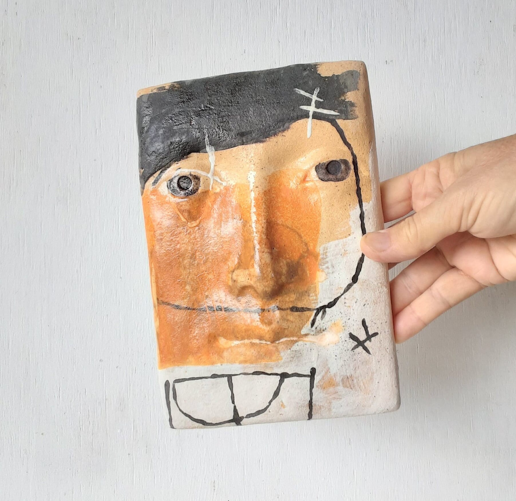 Black white and orange abstract ceramic face, pottery wall sculpture, 3D modern artwork for female birthday gift, Australian made
