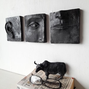 Black wall art triptych, handmade ceramic classic sculpture of face in three parts, hear no see no speak no evil
