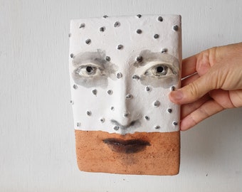 Two tone orange and white modern art tile face, contemporary ceramic art mask