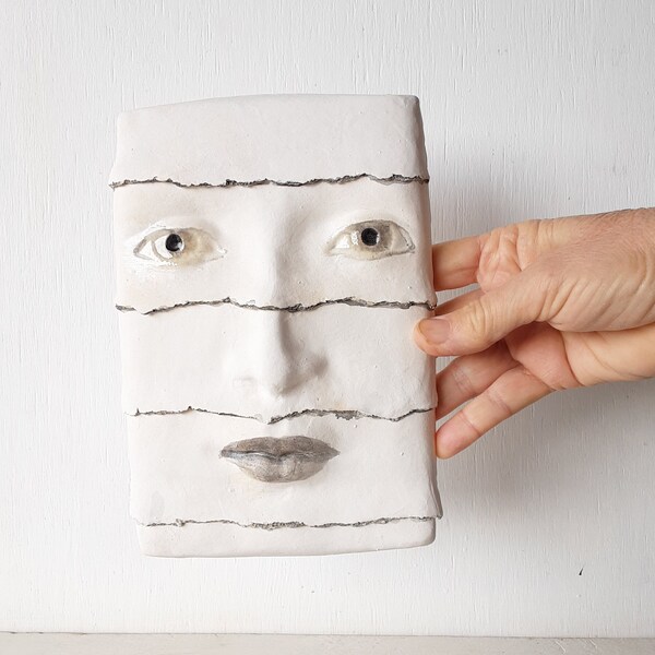 Pottery wall face, abstract head sculpture with raised pattern, black and white decor, minimalist art