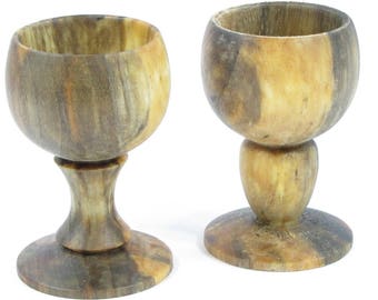 Sold by two country wooden egg Cup.