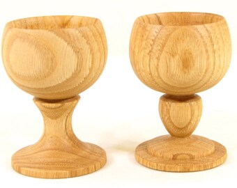 Sold by two country wooden egg Cup.
