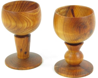 Sold by two country wooden egg Cup.
