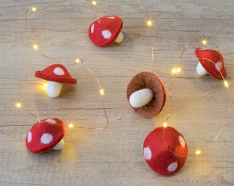 Felt mushroom fairy lights.   Red and white magic mushroom garland.  Warm white fairy lights. Autumn woodland decoration.