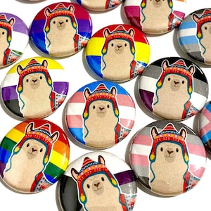May include: A set of 12 round button pins featuring a llama wearing a traditional hat and a different pride flag on each pin.