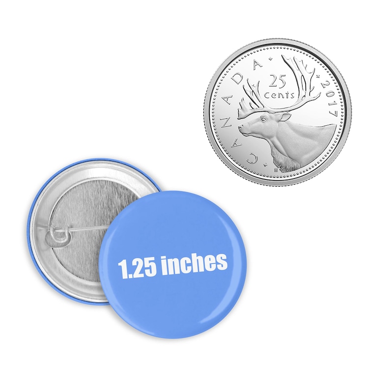 May include: A blue button with white text that reads "1.25 inches" and a silver Canadian 25 cent coin with a caribou on it.