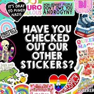 May include: A collection of colorful stickers with various designs and text, including phrases like "It's Okay to Punch Nazis," "Protect Trans Kids," and "Have You Checked Out Our Other Stickers?" The stickers feature rainbows, cats, and other graphics.