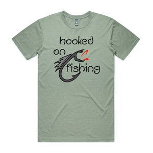 Hooked On Fishing DTG Printed T Shirt | In 10 Colours | Fishing Lure | Fishing Hook | Go Fishing | Fishing Gift | Custom Design | Tee