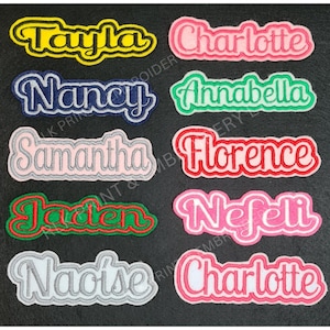May include: Ten embroidered iron-on patches with various names, including Tayla, Charlotte, Nancy, Annabella, Samantha, Florence, Jaden, Nefeli, Naoise, and Charlotte. The patches are in various colours, including yellow, pink, blue, green, red, and white.
