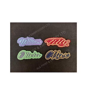 May include: Four embroidered name patches in a variety of colours. The names "William", "Tilly", "Olivia", and "Max" are displayed in a cursive font with a contrasting border. The patches are on a dark background.