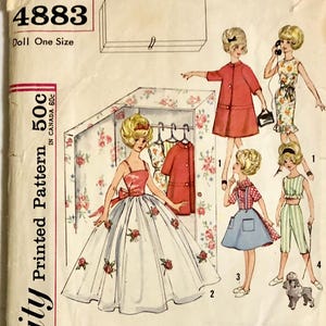 May include: Vintage Simplicity pattern 4883 for a doll, featuring illustrations of various doll outfits. The cover shows a doll in a ball gown and other outfits, with the text "Doll One Size" and "Printed Pattern 50c".