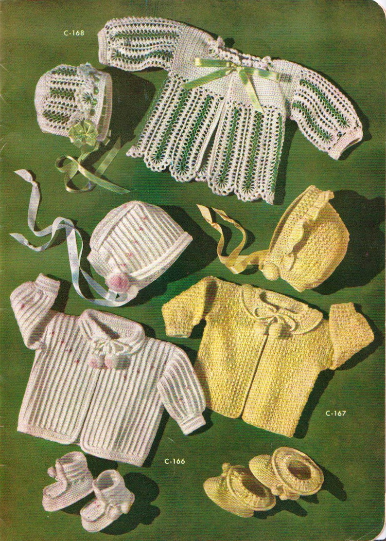 May include: A set of crocheted baby clothes, including a white cardigan, a white hat, a yellow cardigan, a yellow hat, and a pair of white booties. The clothes are laid out on a green background. C-166, C-167, and C-168 are written on the image.