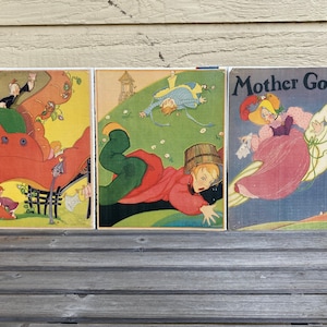 May include: Three vintage Mother Goose children's books with colorful illustrations. The first book shows children playing on a red, oversized shoe. The second book shows a child falling down a hill. The third book shows a girl riding a white goose.