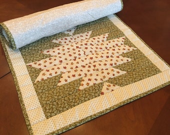 Handcrafted quilted table runner featuring Fall themed colors and prints