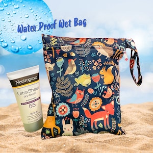 May include: A blue waterproof wet bag with a colorful woodland animal print. The bag has a zipper closure and a handle. A bottle of Neutrogena Ultra Sheer dry-touch sunscreen with SPF 55 is in front of the bag.