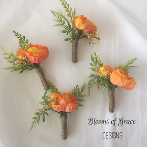 Fall orange boutonniere , groomsmen flowers, groom boutonniere.