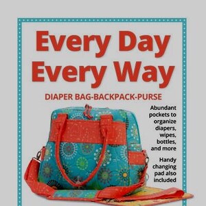 May include: A turquoise and orange diaper bag with a changing pad. The bag has multiple pockets and can be worn as a backpack, purse, or shoulder bag. The text "Every Day Every Way" and "DIAPER BAG-BACKPACK-PURSE" is displayed on the image. The text "byannie.com" is also displayed on the image.