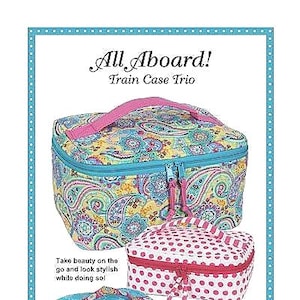 May include: Three train case trio in different patterns and colors. The largest case is paisley patterned with a turquoise zipper and pink handle. The medium case is pink with white polka dots and a red zipper. The smallest case is turquoise with a geometric pattern and a silver zipper. All Aboard! Train Case Trio. Patterns by Annie. www.ByAnnie.com 435-674-9816