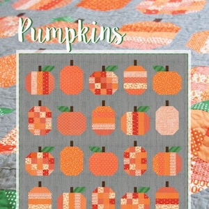 May include: A handmade quilt featuring a pattern of orange pumpkins with green stems on a gray background. The quilt measures 58 x 72 inches and is labeled "Pumpkins". The quilt is made with various orange fabrics and has a patchwork design.