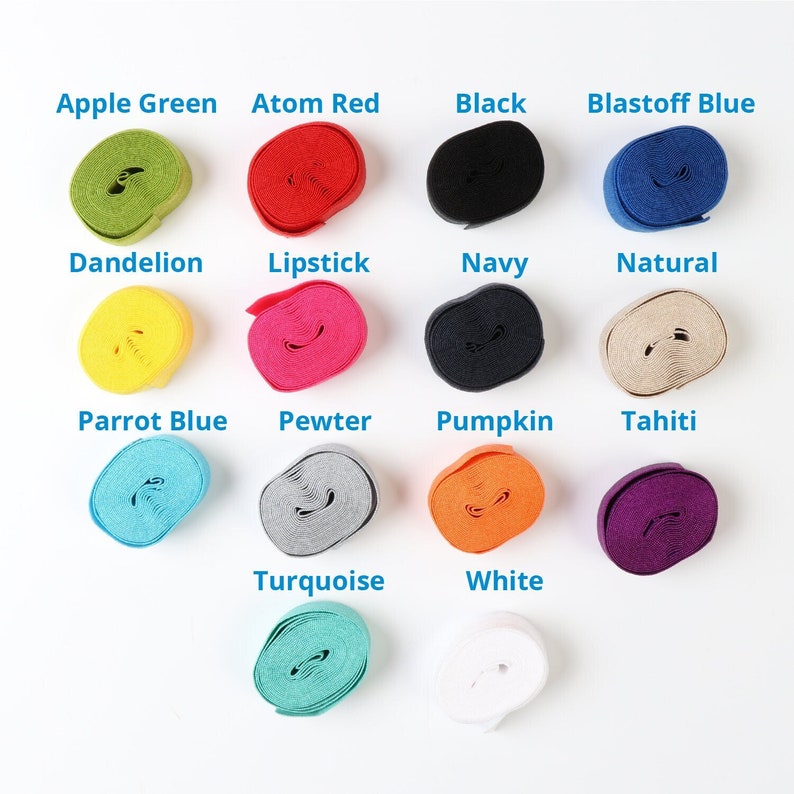 May include: A collection of 14 spools of elastic in various colors, including apple green, atom red, black, blastoff blue, dandelion, lipstick, navy, natural, parrot blue, pewter, pumpkin, tahiti, turquoise, and white.
