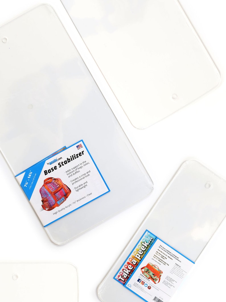 May include: Two clear acrylic base stabilizers for bags and totes. The stabilizers are 1/16 inch thick and have a hole at the top for hanging. The text on the packaging reads "Base Stabilizer" and "Take a peek..."