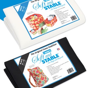 May include: Two rolls of white and black foam stabiliser fabric, each measuring 91.5 cm by 147 cm. The fabric is labelled "Soft and Stable" and is designed for bags and beyond. The label also states that the fabric provides structure and stability, is easy to sew, firm yet resilient, and eliminates the need for adhesives.