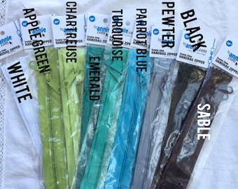 May include: Assortment of 30-inch double-slide handbag zippers in various colours, including white, apple green, chartreuse, emerald, turquoise, parrot blue, pewter, black, and sable.
