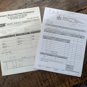 May include: Black and white photo finishing order form from Jensen Reproduction Company. The form has fields for customer name, address, phone number, order number, and special instructions. The customer has filled out the form with their name, address, and special instructions.