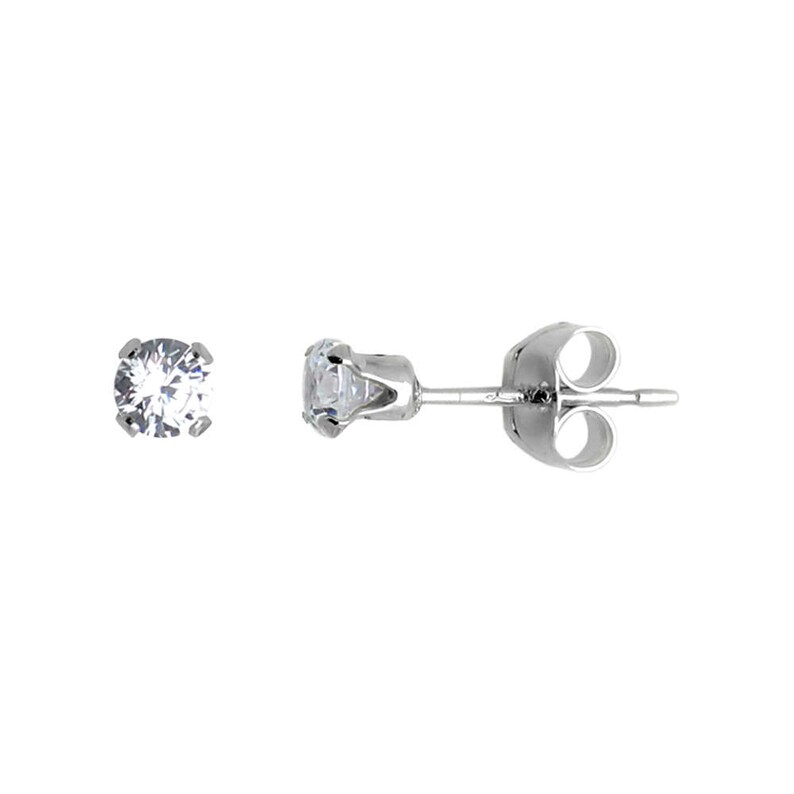 May include: A pair of silver stud earrings with a clear round stone in the center.