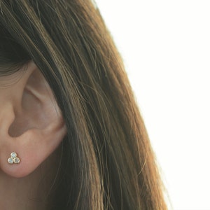 Three diamond cz earrings. Sterling silver three cz earrings. Sterling silver rose gold plated tiny three cz earrings. Dainty cz earrings.