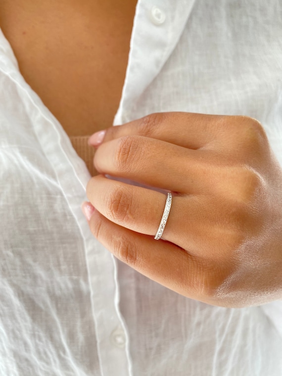 thumbnail interactive-video image 1 of Synergy Trading .925 Sterling Silver 2mm Eternity Band – Clear CZ Channel Set Ring (Sizes 4-12) 1 of 2