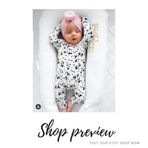 monochrome baby romper with pink baby turban