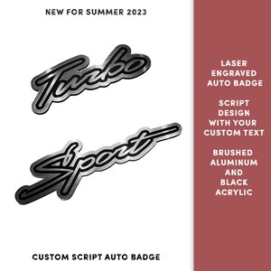 May include: Two silver metal car badges with black lettering. The top badge says "Turbo" and the bottom badge says "Sport". The badges are laser engraved and made of brushed aluminum and black acrylic.