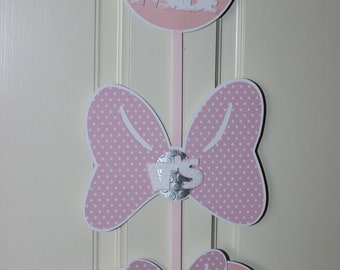 May include: Three pink and white polka dot Minnie Mouse head-shaped door hangers with the words "Come Inside", "It's", and "Fun Inside".