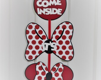 May include: Red and white Minnie Mouse themed door hanger with the words "Come Inside", "It's Fun Inside" and a red bow with white polka dots.