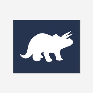 May include: White silhouette of a triceratops dinosaur on a dark blue background.