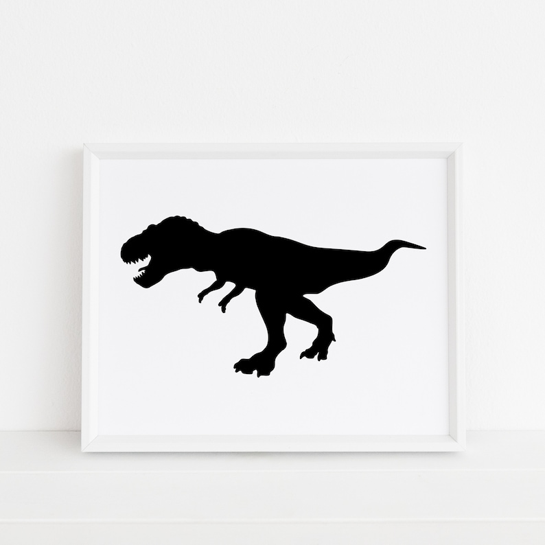 May include: Black silhouette of a Tyrannosaurus Rex dinosaur in a white frame.