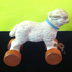 Vintage toy lamb on wheels from 1940