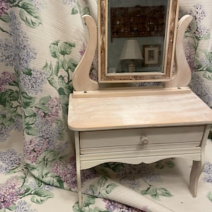 Antique dolls dresser with original mirror.