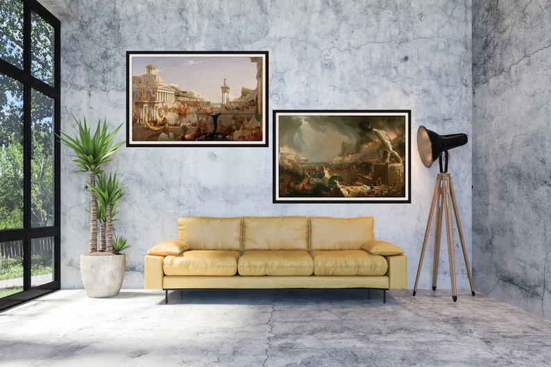 May include: Two framed paintings of historical scenes hang on a gray concrete wall above a yellow couch. The painting on the left depicts a bustling city scene with people and buildings. The painting on the right shows a dramatic scene of a city on fire with smoke and flames.