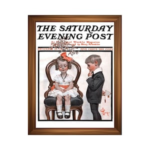 May include: Framed vintage magazine cover of "The Saturday Evening Post" from December 26, featuring a young girl seated in a chair and a boy holding mistletoe. The cover art is in a classic illustration style with a brown wooden frame.