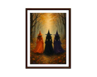 May include: A framed print depicts three witches walking through a forest in autumn. The witches wear long dresses in orange, black, and purple, with matching pointed hats. The background features a path lined with trees and fallen leaves, bathed in warm light.