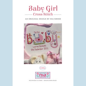 May include: Cross stitch pattern for a baby girl's nursery. The pattern features the word "baby" in colorful letters with a pink baby carriage and other baby-themed designs. The text reads "7lb 2oz, Lauren Elizabeth, 6th September 2011".
