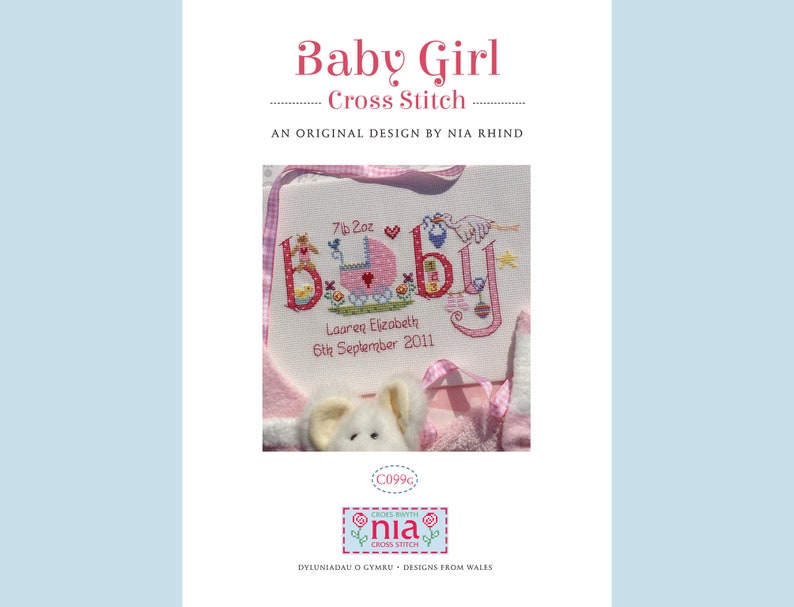 May include: Cross stitch pattern for a baby girl's nursery. The pattern features the word "baby" in colorful letters with a pink baby carriage and other baby-themed designs. The text reads "7lb 2oz, Lauren Elizabeth, 6th September 2011".