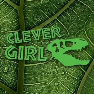 May include: Green leaf with the words "CLEVER GIRL" in green outlined letters and a green dinosaur skull silhouette.