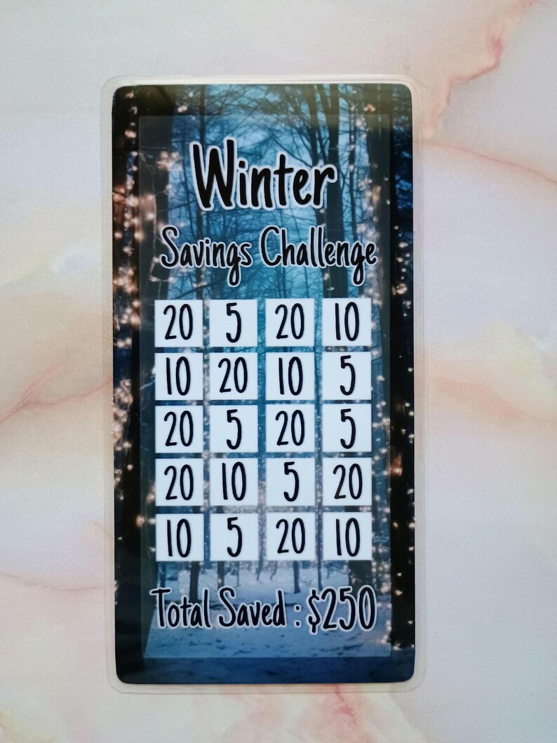 May include: A Winter Savings Challenge card with a snowy forest background. The card has a grid of squares with numbers in each square, totaling $250.
