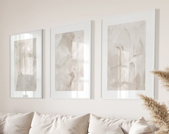 May include: A white sectional sofa with a throw blanket and pillows in a living room with a wooden coffee table, a lamp, and a vase of dried pampas grass.