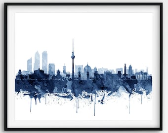 May include: A watercolor painting of the Berlin skyline in shades of blue. The painting features iconic landmarks like the Brandenburg Gate and the Berlin TV Tower.