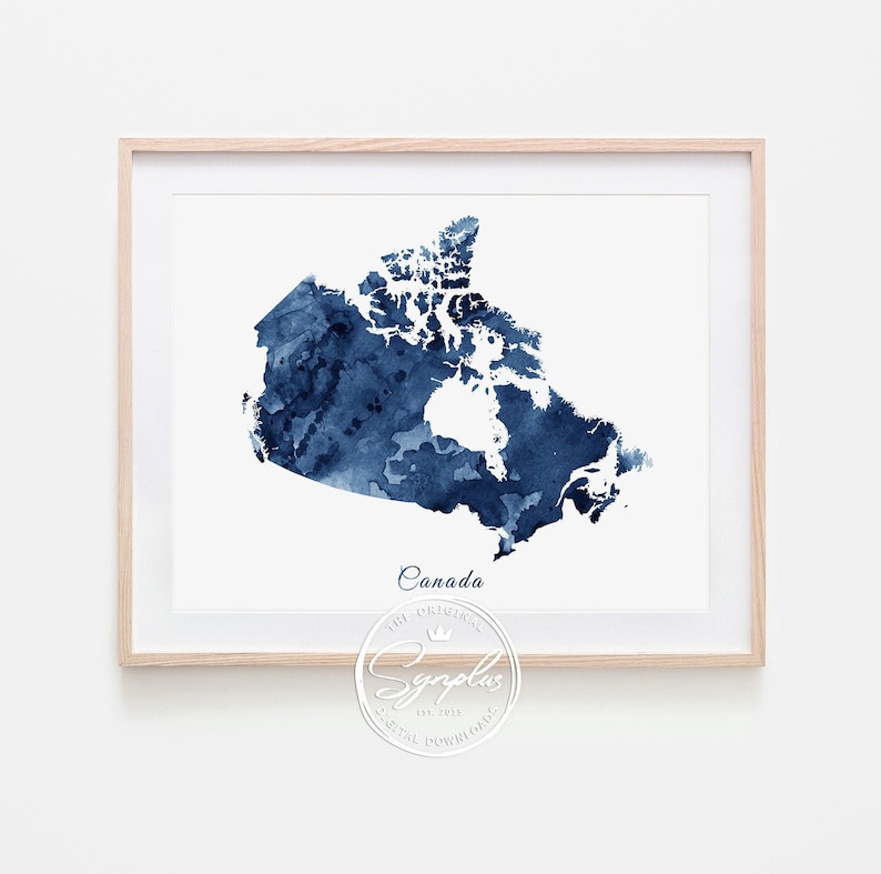May include: A watercolor painting of a map of Canada in shades of blue. The map is framed in a light wood frame. The text "Canada" is printed below the map, and a logo for "Symplus" is printed below the text.