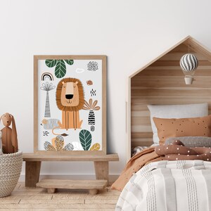 May include: A colorful illustration of a lion with a jungle background. The lion is orange with a brown mane and is sitting in a green jungle with a rainbow and other plants. The illustration is framed in a light brown frame.